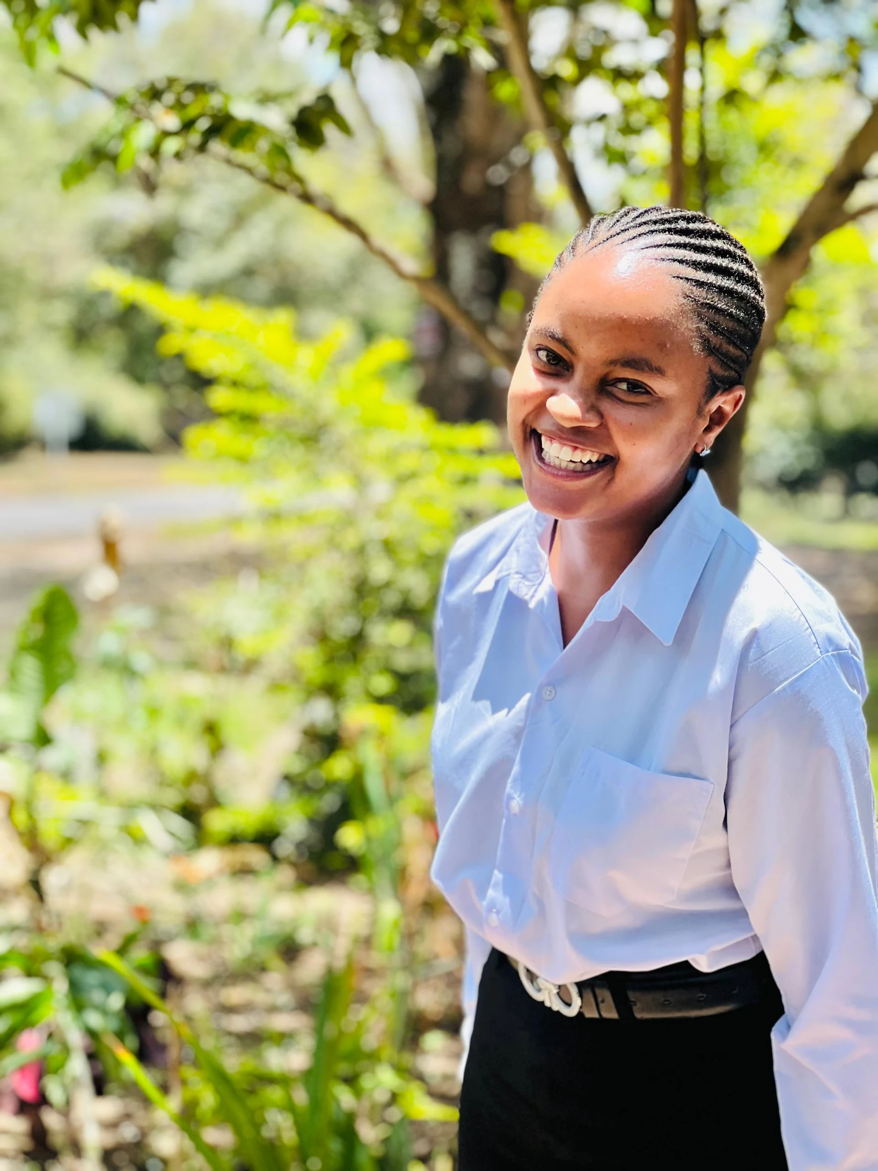 A smiling Keepsake student standing outdoors