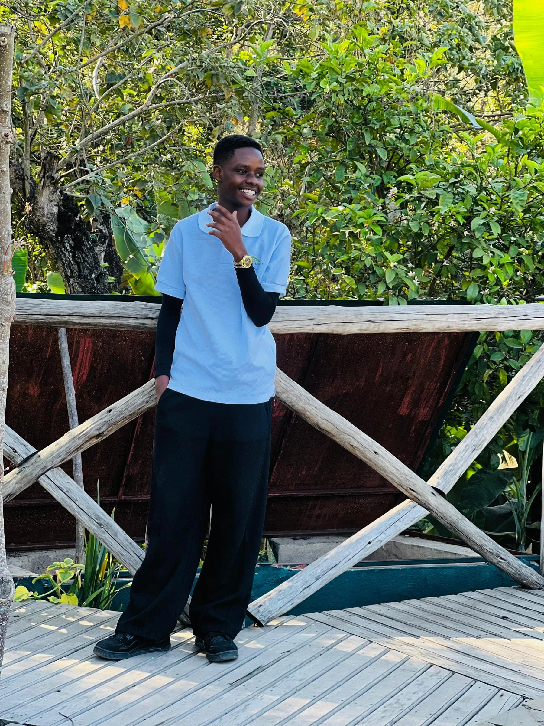 A Keepsake student beside an outdoor railing
