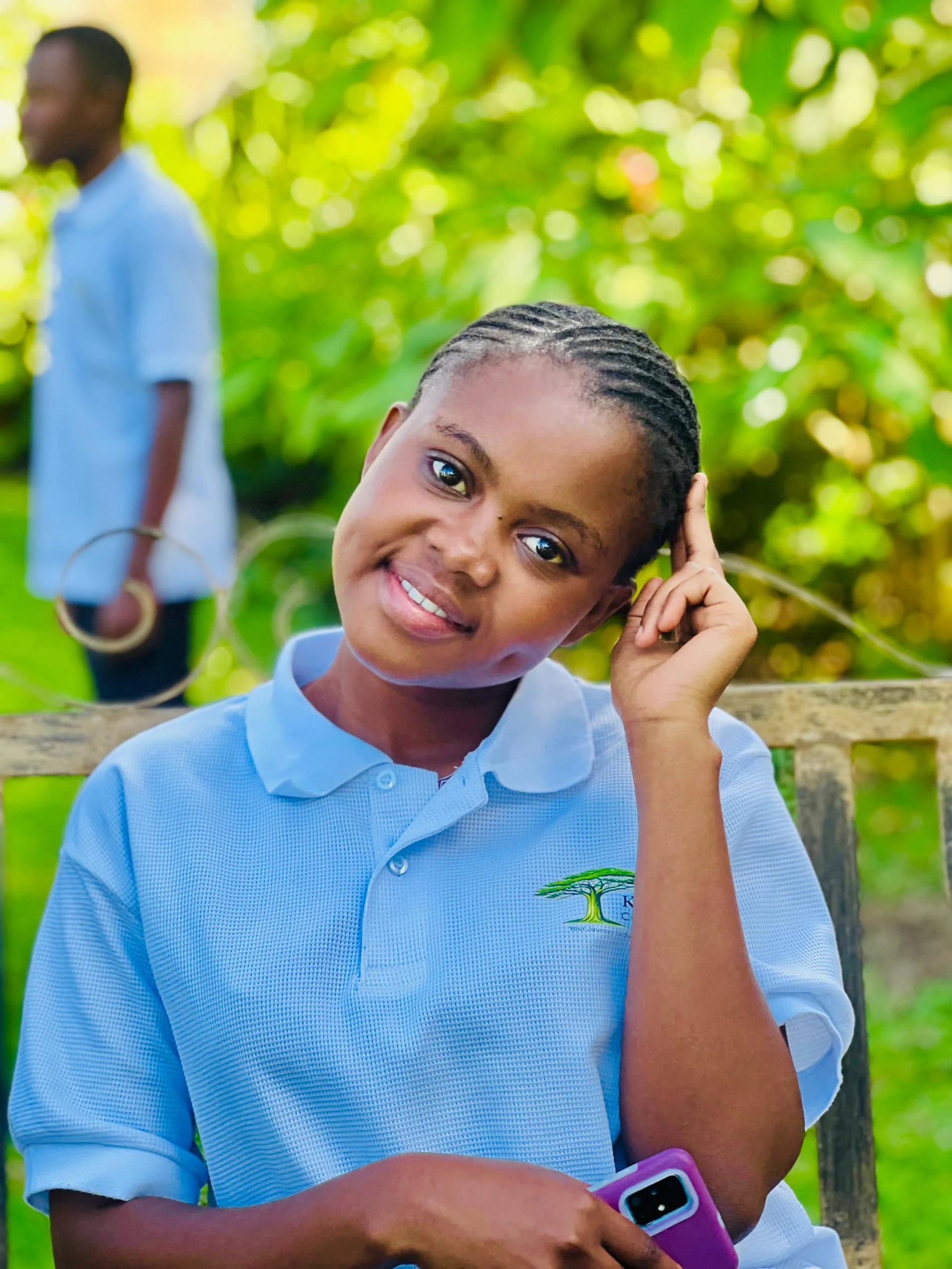 A Keepsake student smiling in a garden