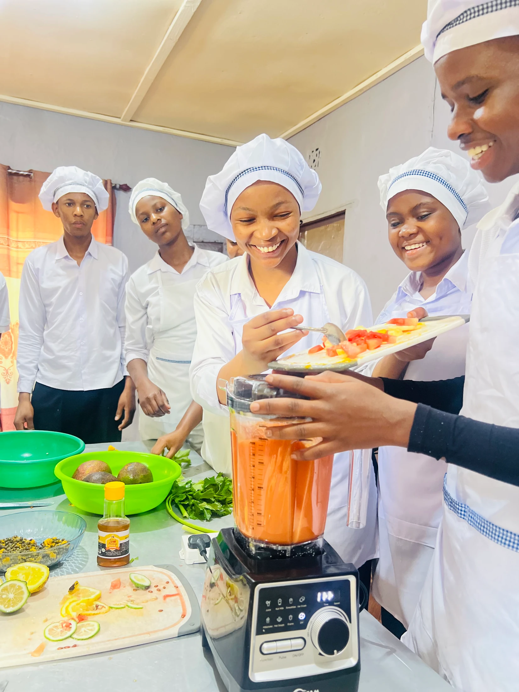 Keepsake culinary students preparing fruit in a blender