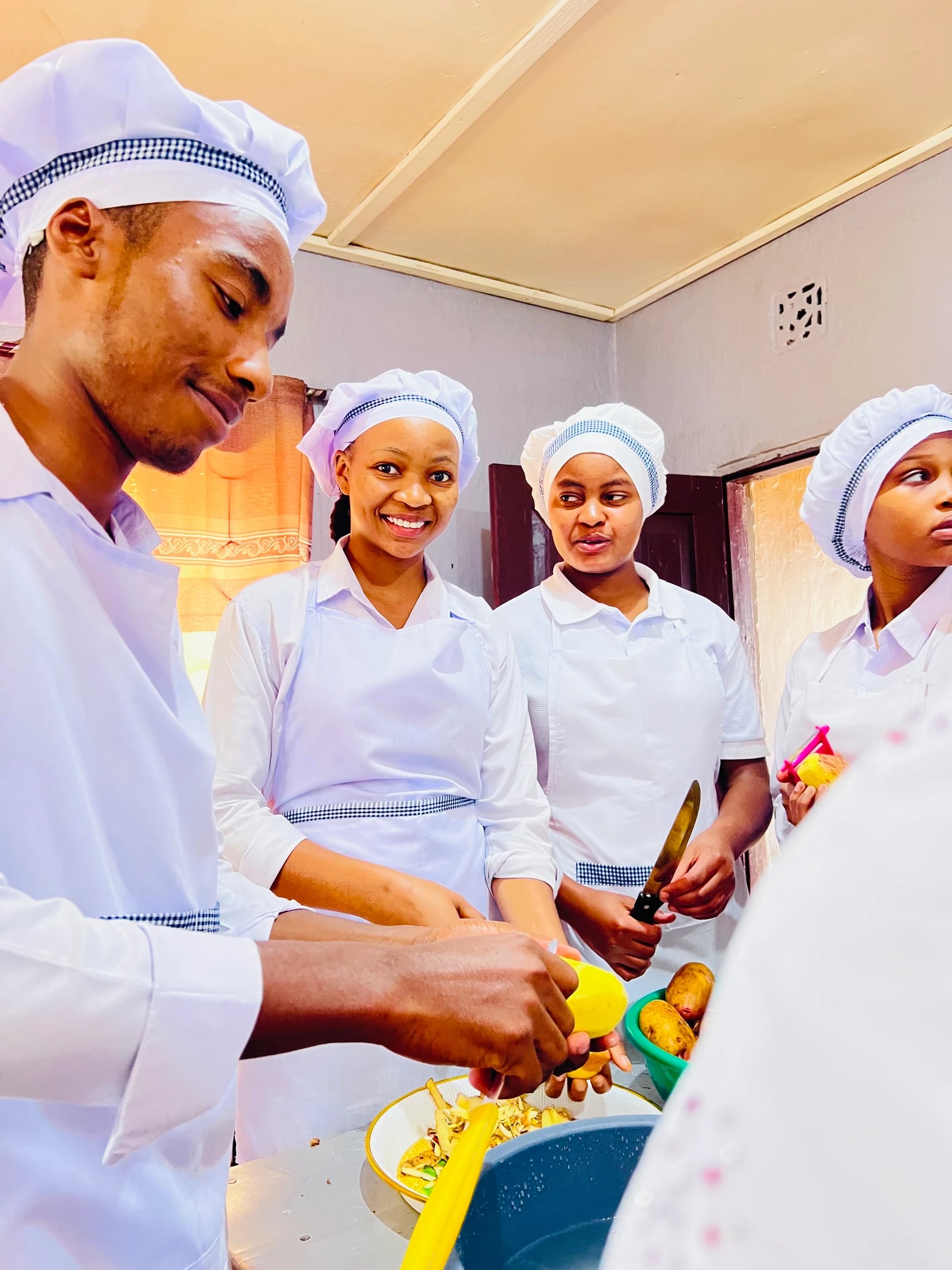 Keepsake culinary students preparing ingredients with knives and bowls