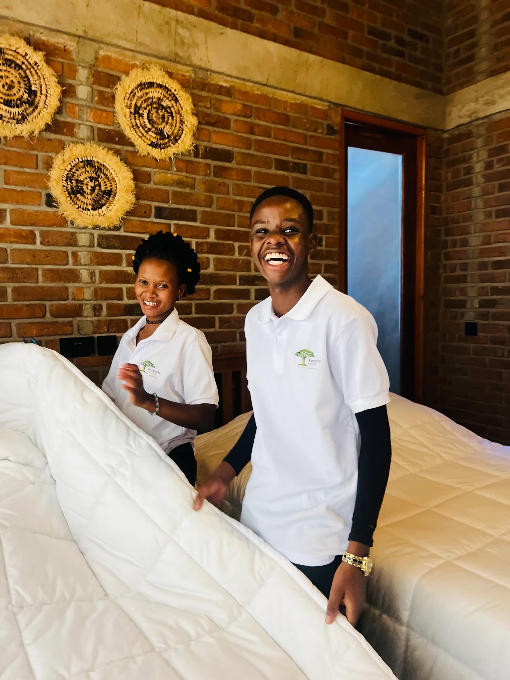 Two Keepsake students preparing a bed during training