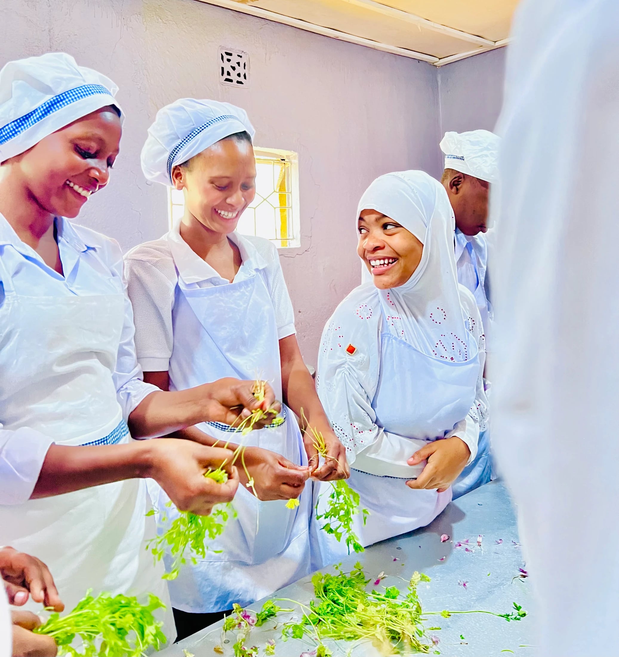Three Keepsake students preparing ingredients together