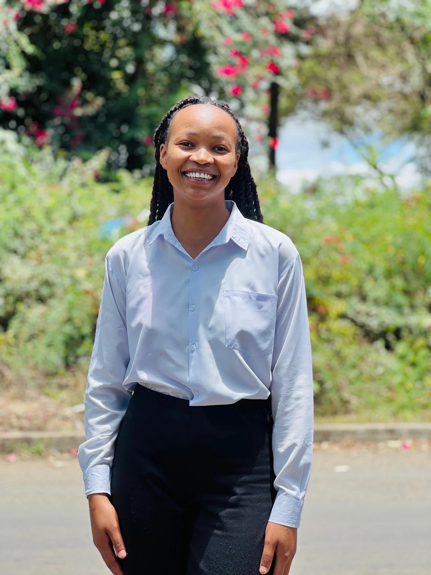 A Keepsake student smiling in a garden
