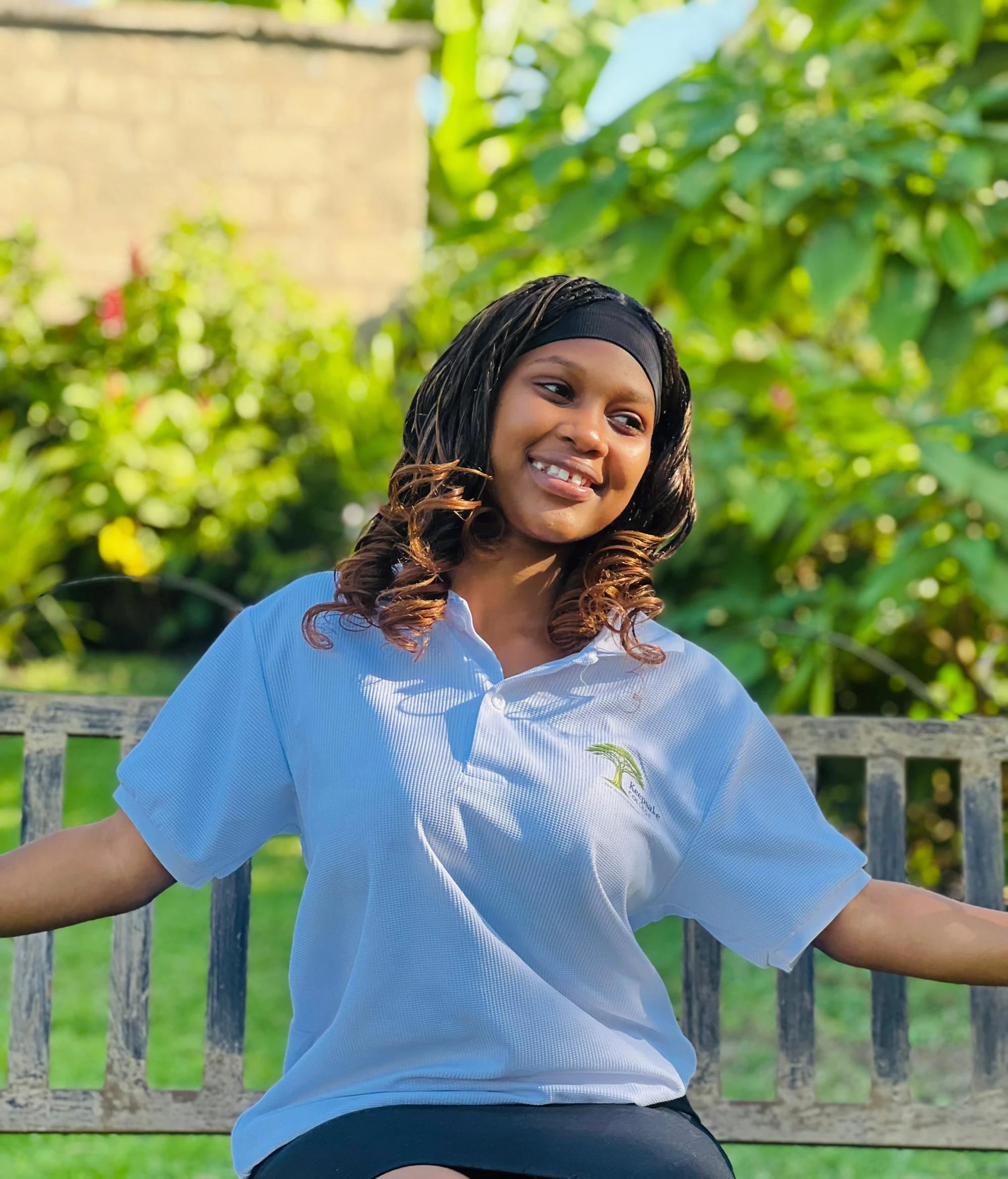 A Keepsake student standing in a garden